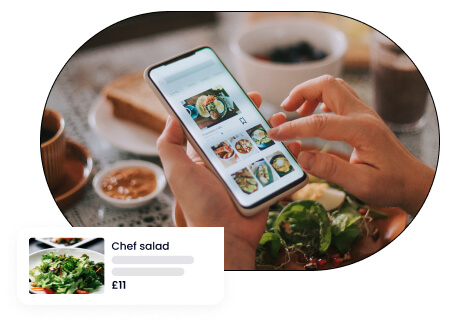 A concept of online food ordering highlighting a smartphone screen displaying a food ordering app