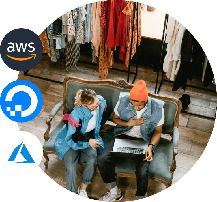 Two individuals sitting in a retail store and looking at a laptop screen with AWS, DigitalOcean and Azure logos in the foreground.